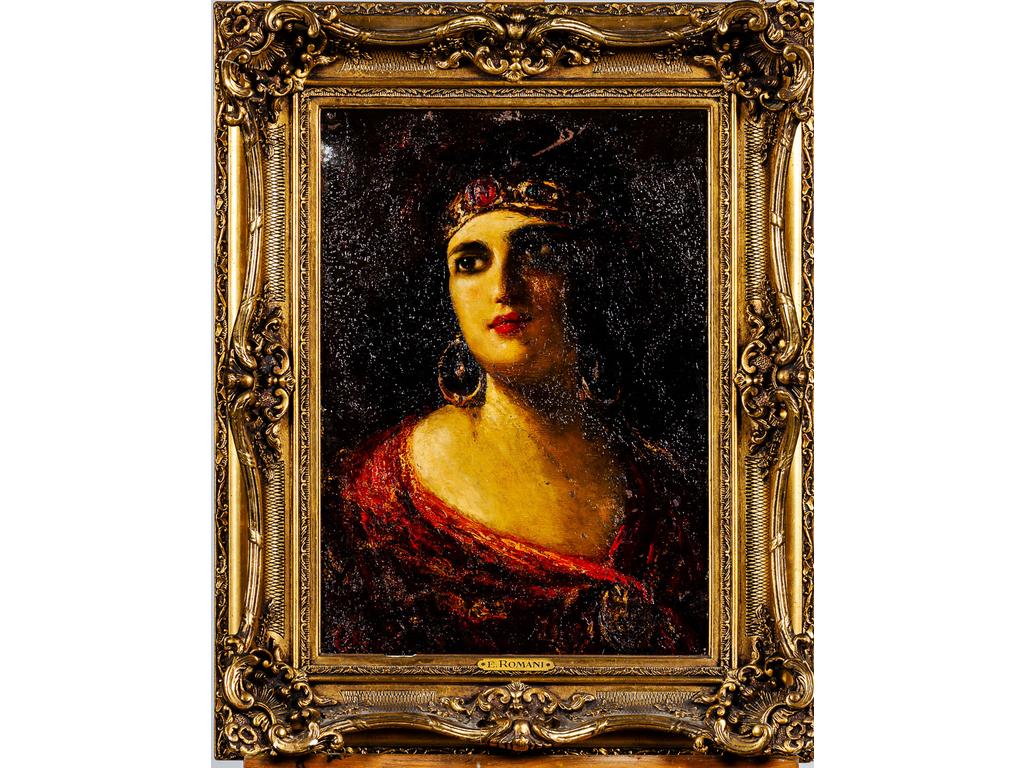 E. ROMANI (XXème siècle) : Portrait de femme au diadème. Huile sur panneau signée en bas à gauche. (Eraflure). Dim : 50 x 36 cm.