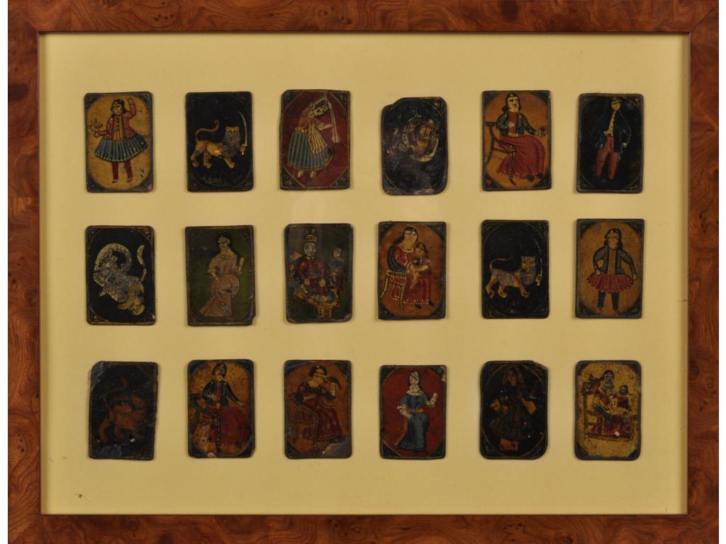 PERSE : Suite de 18 cartes de jeu en cuir peint figurant des personnages et animaux. Encadrés sous verre. (Usures et manques). Dim du cadre : 33 x 43 cm.