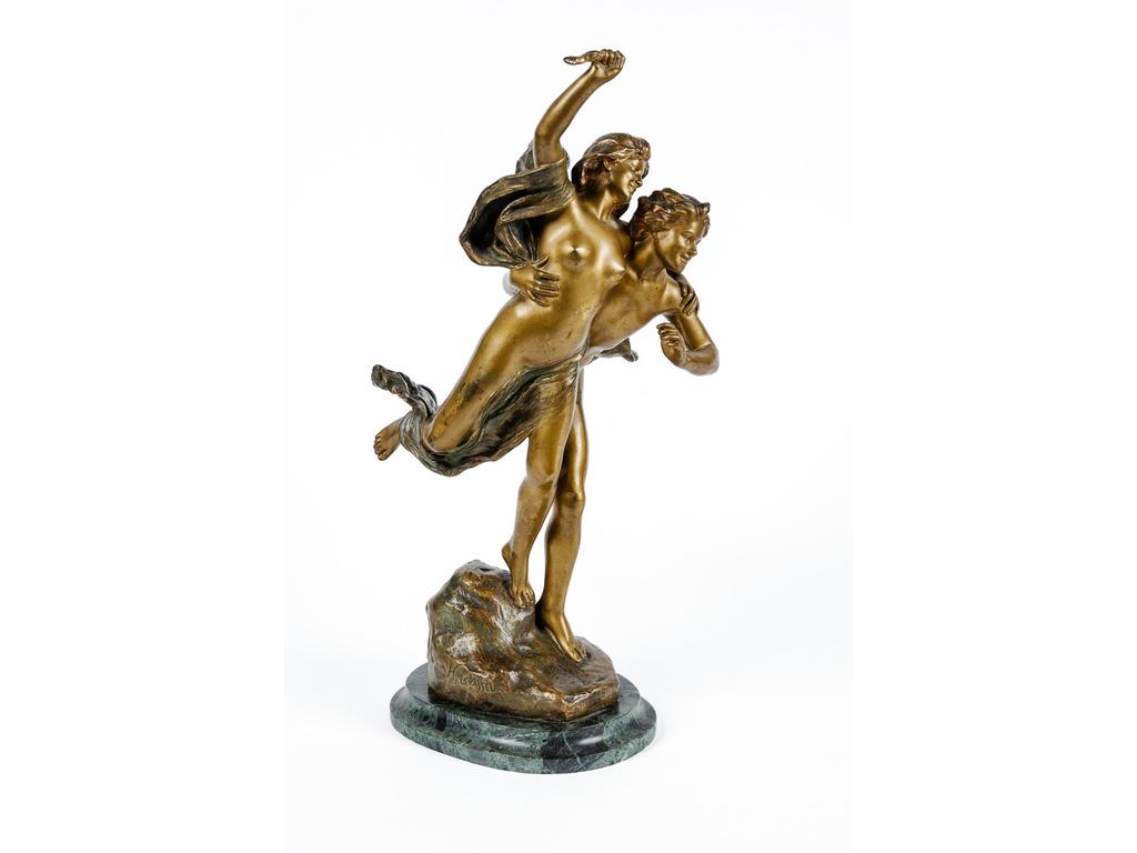 Henri LEVASSEUR (1853-1934) : Apollon et Daphné. Groupe en bronze patiné reposant sur un socle en marbre vert, fonte d'édition signée sur la terrasse. (Manque un élément dans la main droite de Daphné). Hauteur totale : 47 cm.
