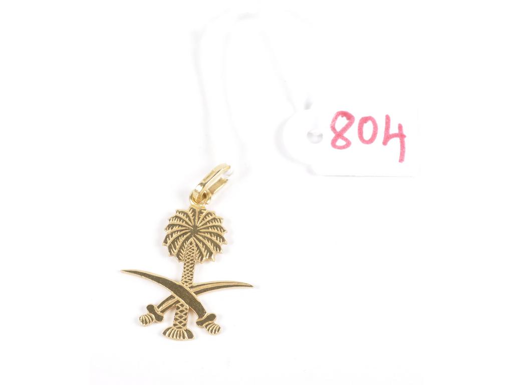 Pendentif emblème de l' Arabie Saoudite en or jaune. (AC). Poids : 3.3 gr.