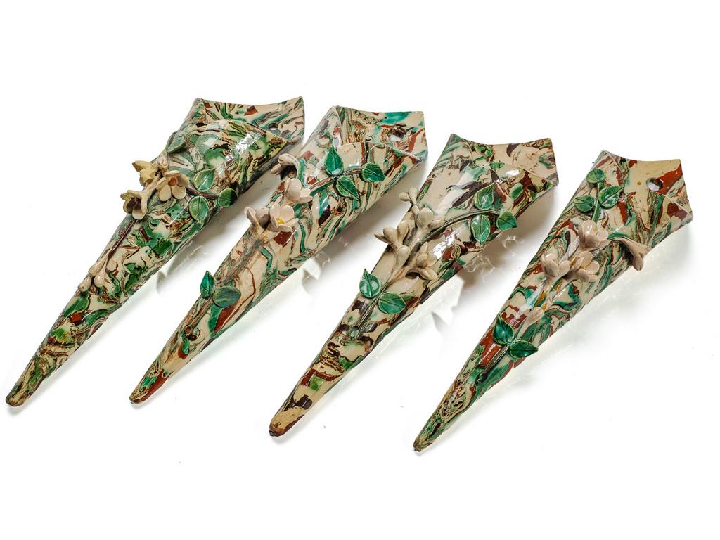 Manufacture PICHON à Uzès : Quatre bouquetières de forme cornet à décor, en relief, de fleurs sur fond marbré en terres mêlées. Hauteurs : 28,5 cm.