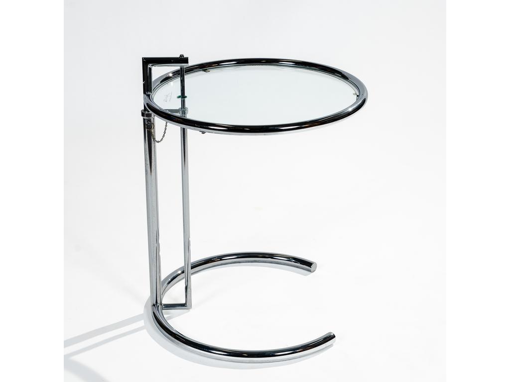 D'après Eilen GRAY : Table de salon en acier ajustable tubulaire chromé. Plateau circulaire en verre. Plateau gravé de l'Editeur. Diamètre : 50 cm.