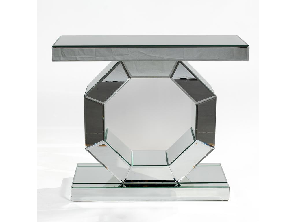 Console moderne dite de miroitier. Structure en bois aggloméré. Plateau rectangulaire reposant sur un élément octogonal ajouré et sur une plinthe. L'ensemble entièrement plaqué de miroirs biseautés (sur les deux faces). Hauteur : 85 cm. Dim plateau : 101 x 41 cm. (Un petit éclat sur un angle de la plinthe).