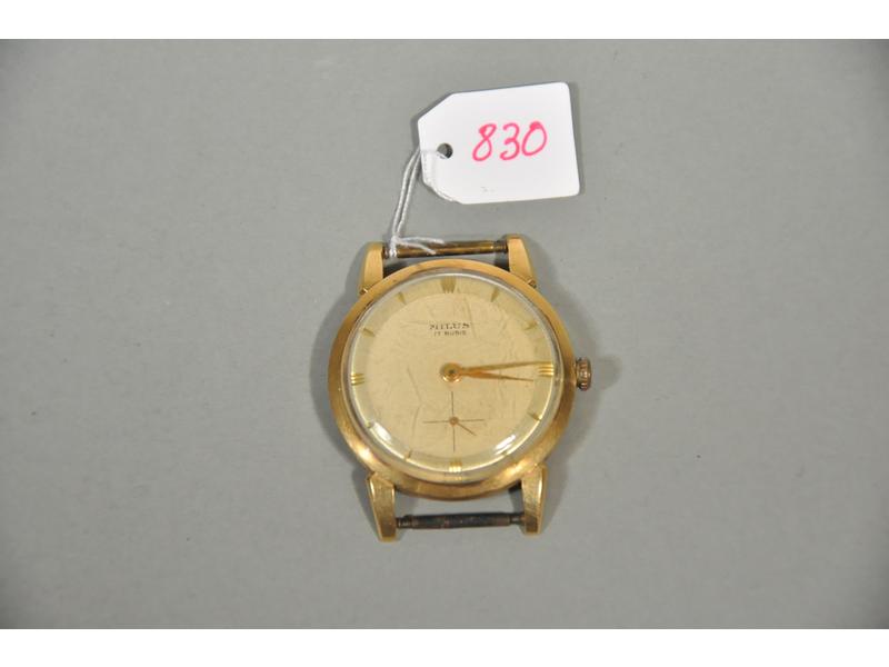 Une montre homme en or de marque MILUS. Mouvement mécanique (éta