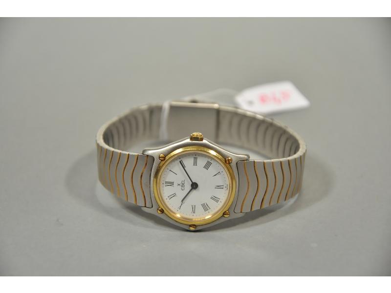 EBEL: Montre-bracelet de dame en or et acier. Boitier rond, cadr