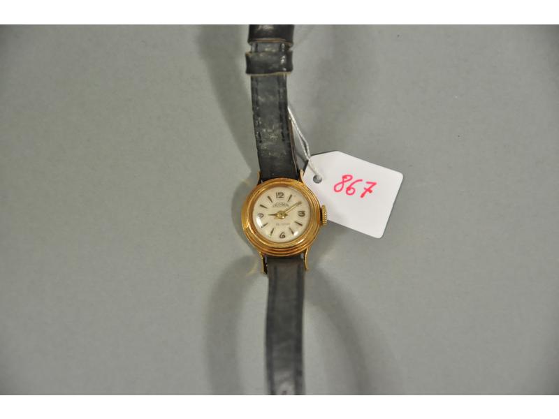 JUSMA: Montre dame en or. Mouvement mécanique, bracelet en cuir.