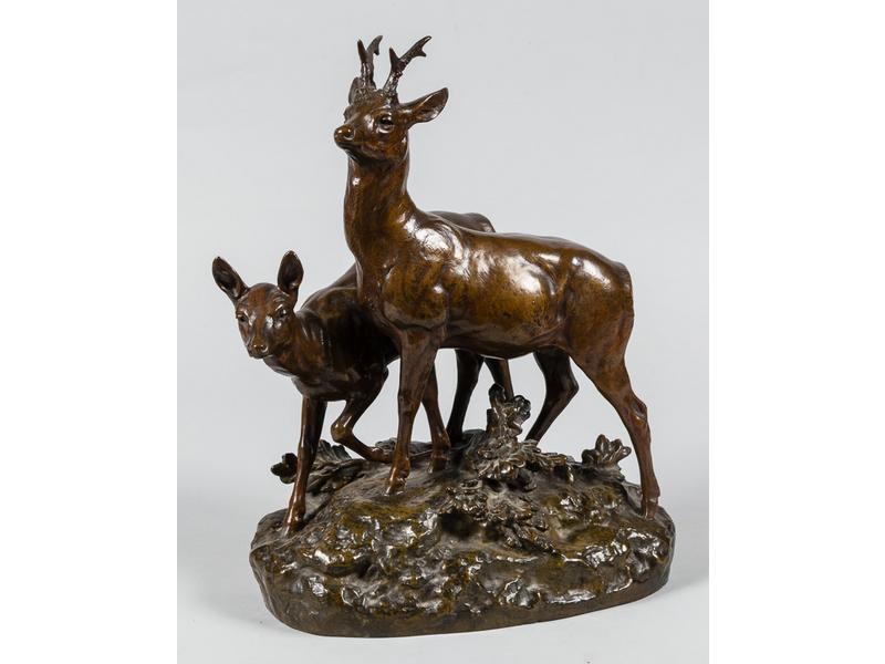 Jules Edmond MASSON (1871-1932) : Couple de cervidés.  Sujet en bronze à patine médaille.  Signé sur le socle, édité par Goldscheider (cachet de fondeur).  Hauteur : 38 cm.