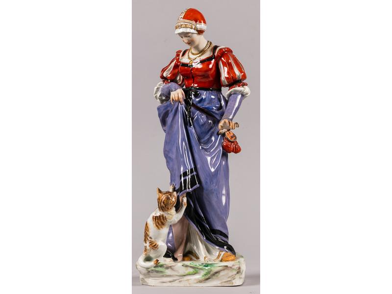 MEISSEN : Sujet en porcelaine peinte représentant une femme en habit Renaissance et un chat.  Marqué.  Hauteur : 40 cm. (petits accidents et restaurations : queue et oreille du chat, main gauche du personnage)
