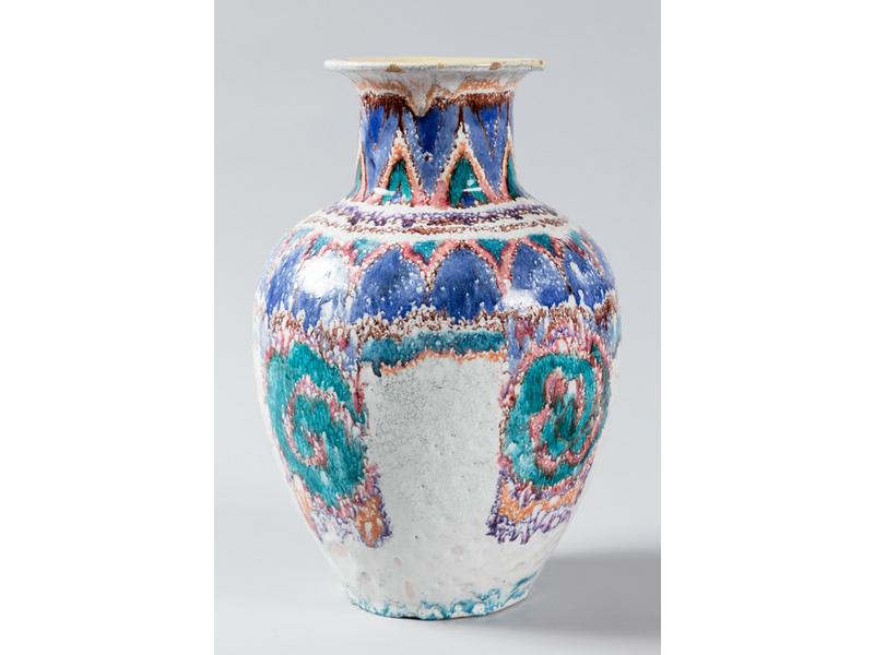 Vase balustre en terre cuite émaillée à décor abstrait et géométrique polychrome.  Signé C.A.P.  Hauteur : 34 cm. (infimes éclats d'émail au col)
