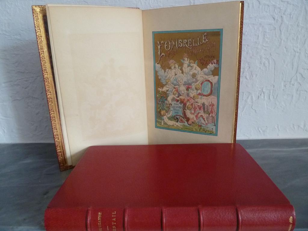 UZANNE, Octave. (AVRIL, Paul) : Léventail. Paris : Quantin, 1882. 1 volume grand in-8°. Reliure de lépoque plein maroquin rouge, dos à nerfs janséniste, auteur, titre, et date en queue dorés, double filet doré sur coupes, succession de filets et roulettes dorées sur chasses, toutes tranches dorées. Reliure signée par AMAND. Les fragiles couvertures en couleurs ont été conservées, de même la 1ère de couverture de la suite. Nombreuses illustrations in-texte en couleurs de Paul AVRIL. EDITION ORIGINALE. 1 des 100 ex. sur japon avec une suite des gravures interfoliée. ON Y JOINT du même auteur et illsutrateur, en reliure identique signée par Amand : Lombrelle, le gant, le manchon. Paris : Quantin, 1883. Les mêmes couvertures conservées. Ex. sur Japon également avec suite interfoliée. SUPERBE EXEMPLAIRE, parfaitement établi et conservées, avec suite.