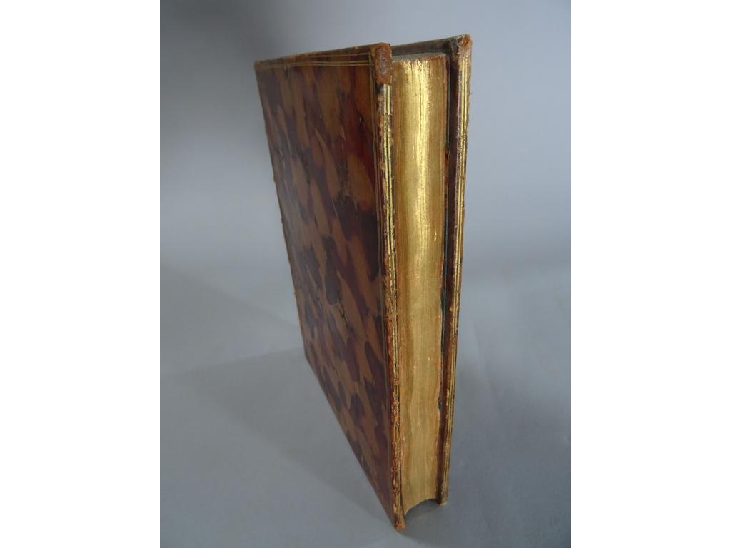 ERASME. (EISEN) : Léloge de la folie. S.l [Paris] : S.e., 1751. Un volume in-4° réimposé. Reliure de lépoque plein écaille, dos à nerfs orné de caissons de double filet doré fleuronnés, triple filet doré en encadrement des plats, double filet doré sur coupes, toutes tranches dorées. 1er tirage du frontispice, fleuron sur tire, dun en-tête, un cul-de lampe et des 13 hors-texte de Charles EISEN, gravés par Aliamet, De la Fosse, Flipart, Le Mire etc. Exemplaire en grand papier au format un-4° réimposé comprenant le frontispice dEisen dans un bel encadrement ( Cohen : 348). TRES BEL EXEMPLAIRE.
