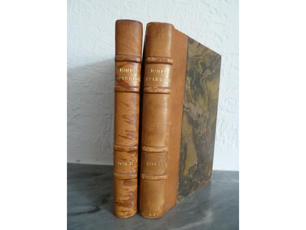 ASSOCIATION FRANCAISE pour lavancement des sciences : Nîmes et le Gard. Nîmes : La Laborieuse, 1912. 2 volumes in-8°. Reliures de lépoque demi-basane blonde, dos à 4 nerfs sautés titré. Quelques illustrations et planches dépliantes. Quelques frottis, ombres au dos du tome 2.