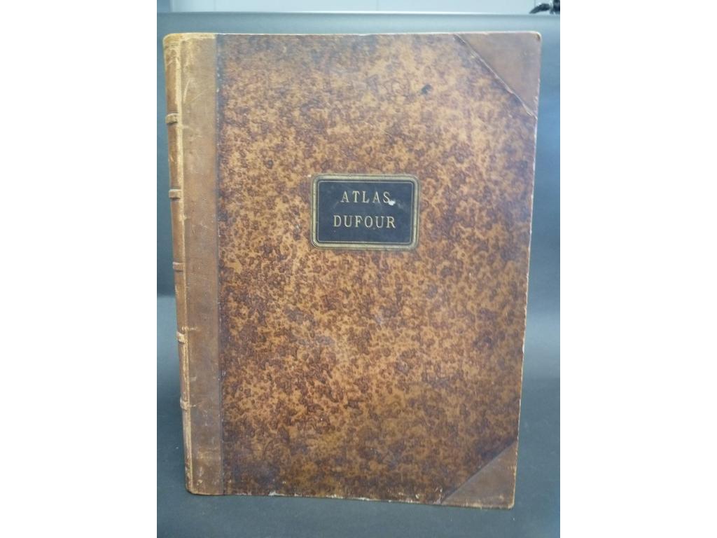 DUFOUR, H. : Atlas universel physique, historique et politique. Géographie ancienne et moderne. Paris : Armand le Chevalier, s.d. (circa 1860). Un volume grand in-folio. Reliure de lépoque demi-chagrin miel à coins, dos à nerfs soulignés de filets à froid, large pièce de titre en maroquin noir appliqué sur 1er plat. Bien complet de ses 40 belles cartes gravées sur acier en couleurs à double page, montées sur onglets. Quelques usures. BON EXEMPLAIRE.