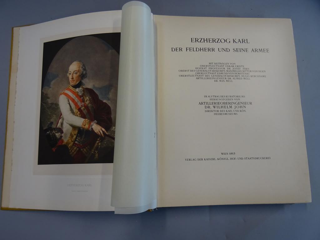 WILHEM, John : Erzherzog Karl. Der feldherr und seine armee. Wien : Kaiserl, 1913. Un volume fort in folio. Reliure de léditeur plein maroquin citron, large frise feuillagée dorée en encadrement des plats avec grande armes de lArchiduc au centre du 1er plat, dos lisse ornée de la même frise, contregardes er gardes de moire ivoire, tête dorée. Reliure signée de latelier de Vienne daprès un dessin de Josef Hoffman. Illustré de 2 gravures originales en couleurs de Luigi Kasimir, 7 héliogravures et 78 planches. Un des 60 exemplaires numérotés de l'édition spéciale sur 404.  Monographie artistiquement extrêmement élaborée consacrée à l'archiduc Friedrich dans une somptueuse reliure en maroquin très bien conservée.