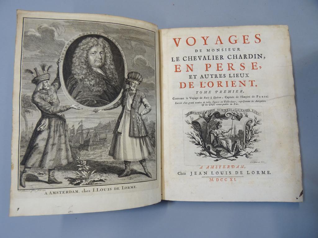 CHARDIN, Jean : Voyage de M. le chevalier Chardin en Perse et autres lieux de l'Orient. Amsterdam, L. de l'Orme, 1711. 3 volumes in-4°. Reliures de l'époque veau havane, dos à nerfs ornés fleuronnés. Première édition complète de ces voyages, illustrée dun portrait en frontispice, de  vignettes sur titre répétées, de 3 en-tête et de ses 78 planches sur 79 dont 52 dépliantes (cartes, plans, vues, scènes etc.). 2 planches présentent une déchirure mais sans manque. Reliures défraichies avec manques divers, bon état intérieur.
