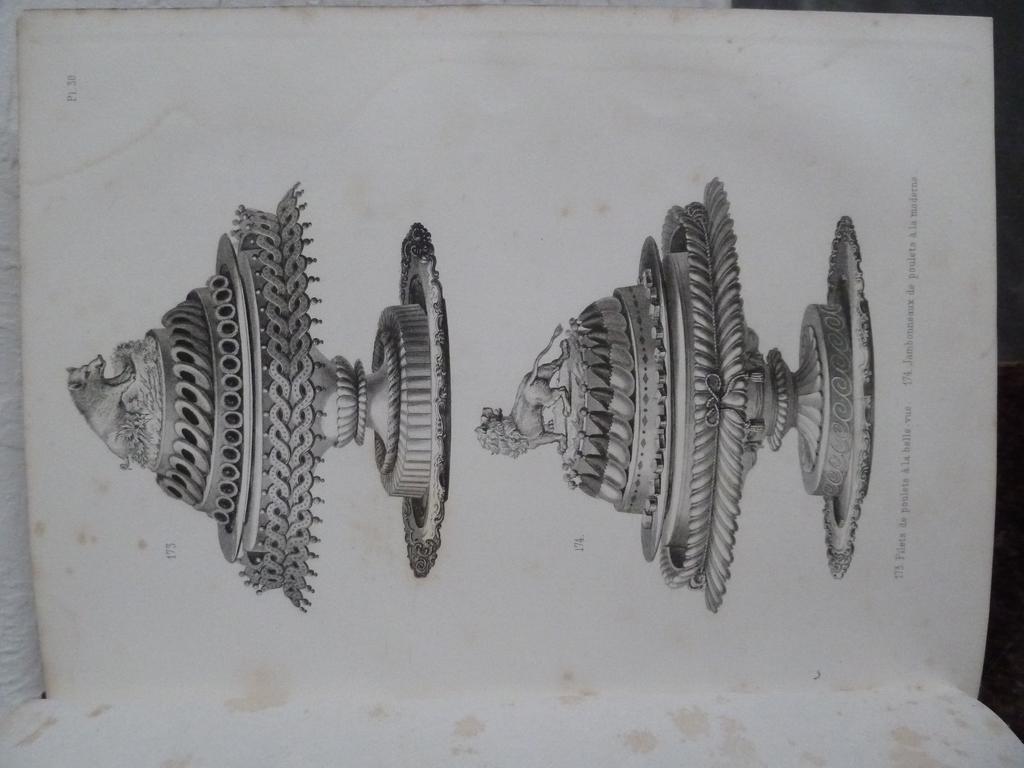 (Cuisine) DUBOIS, Urbain et BERNARD, Emile : La cuisine classique. Etude pratique, raisonnées et démonstratives de lécole française appliquée au service à la russe. Paris : Dentu, 1876. 2 volumes in-4°. Reliures de lépoque demi-cuir de Russie, dos lisses ornés de double filet doré en place des nerfs. Illustré de 63 magnifiques planches gravées hors-texte représentant près de 350 dessins. La planche des portrais du Kaiser et de limpératrice manque comme toujours pour des raisons liées au contexte historique de lépoque. Rousseurs passim, petites mouillures très pâles en marge de quelques feuillets, frottis. ON Y JOINT : - LACAM, Pierre : Le mémorial historique et géographique de la pâtisserie  Paris : Chez lauteur, 1903. Un volume fort in-8°. Reliure demi-basane rouge. (n.c.) ,    La cuisine moderne illustrée  Paris : Quillet, s.d. (circa 1930), grand in-8°. Reliure éditeur. (n.c.)  , - CLEMENT, Gaston : Le conseiller culinaire. Bruxelles : Editions le Sphinx, 1953. Grand et fort in-8° carré. Reliure éditeur (n.c.)